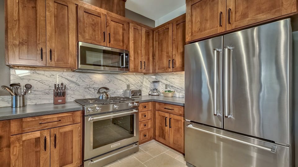 Condo, 2 Bedrooms | Private kitchen | Fridge, microwave, oven, dishwasher