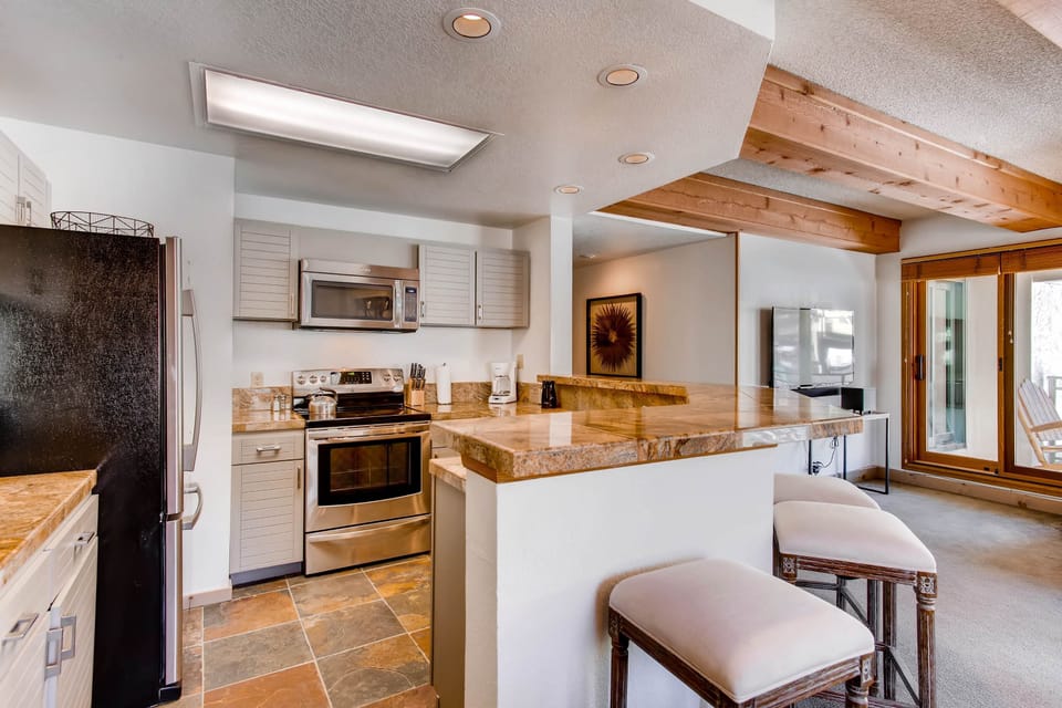 Condo, 2 Bedrooms | Private kitchen | Coffee/tea maker, oven