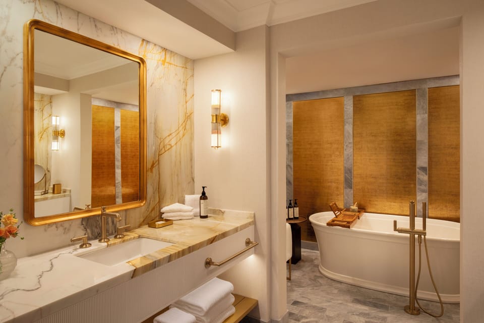 Combined shower/tub, designer toiletries, hair dryer, bathrobes