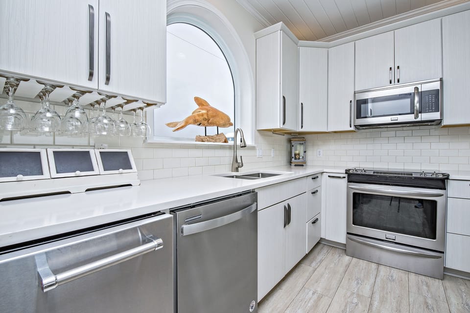 Modern kitchen with nice stainless steel appliances and a convenient ice maker.