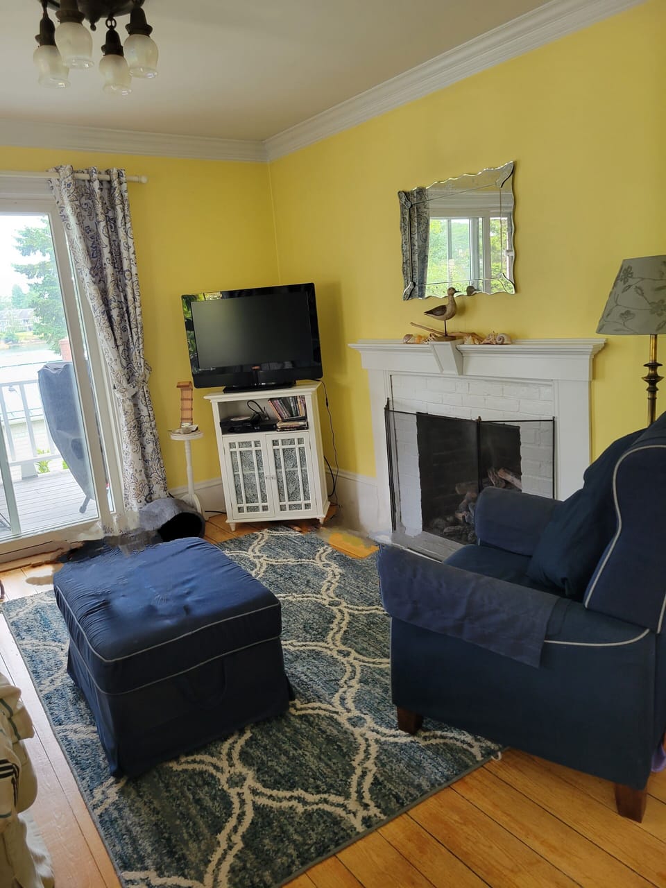 Sitting Room with Flat Screen TV, Fireplace and Lamps for reading.