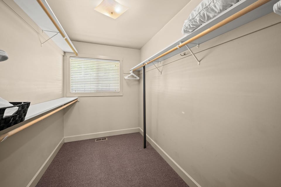 Your private walk-in closet offers generous hanging space and built-in shelving, giving you plenty of room to unpack and settle in comfortably.