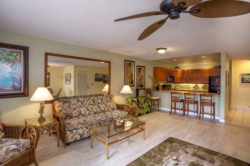 Spacious air-conditioned living room has brand new flooring & a great ocean view