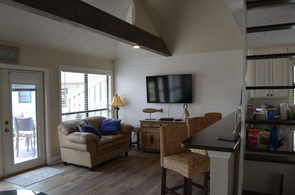 Living room with 60 inches smart TV.
