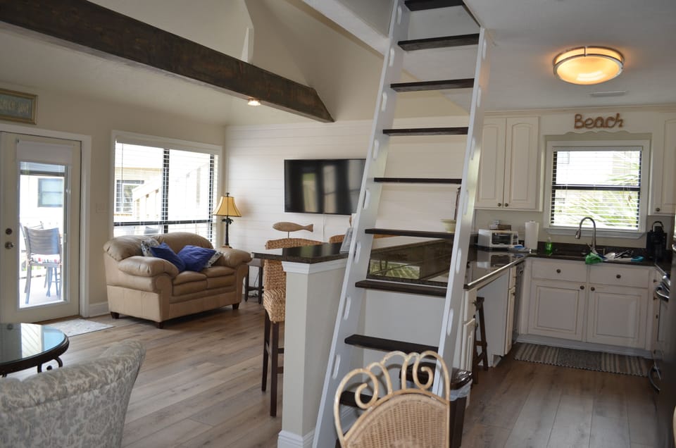 Family room and kitchen with stairs up to the loft.