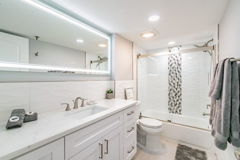 Updated second bathroom with shower and bath tub.