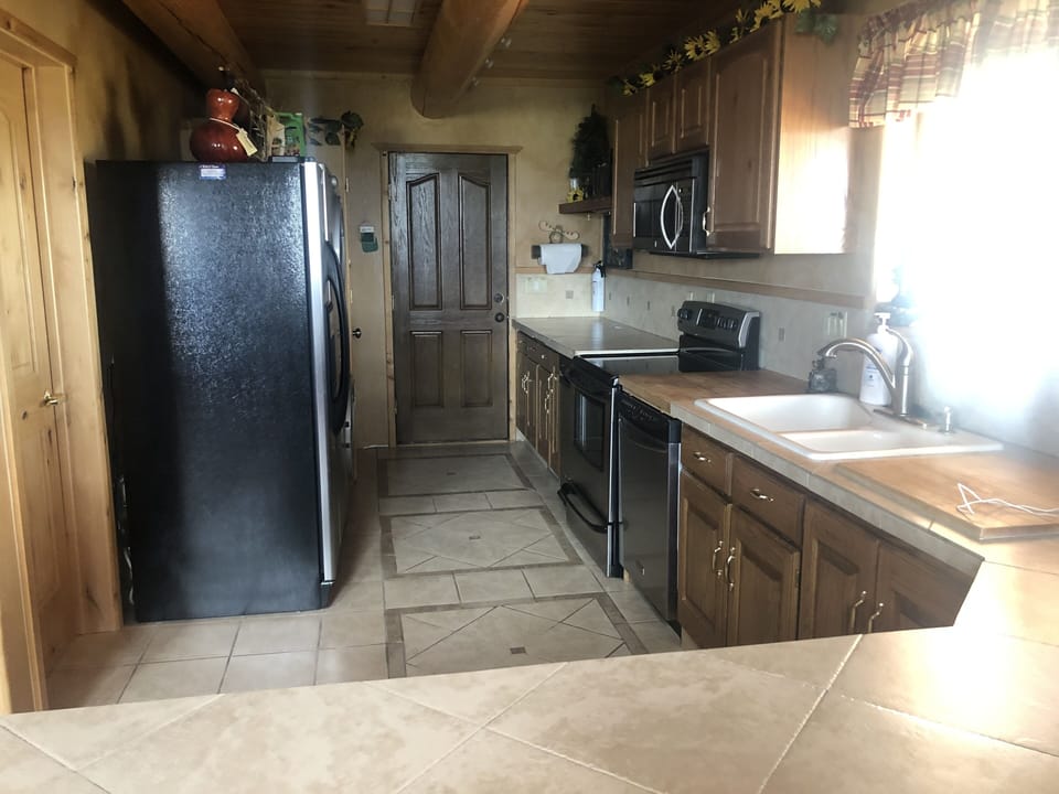 Kitchen with oven/stove,microwave, fridge, dishwasher, washer and dryer.