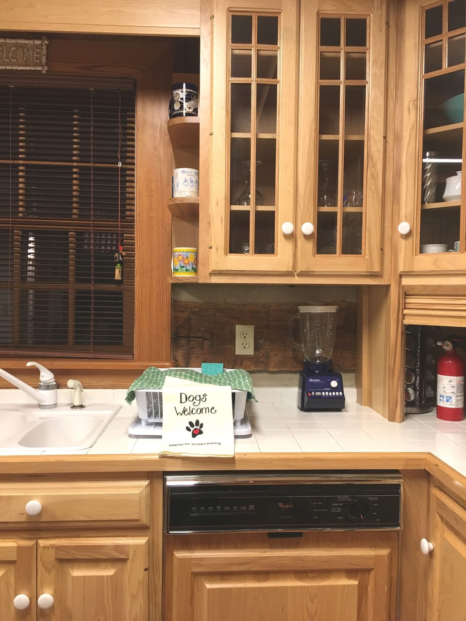 fire extinguisher found in the roll top cabinet in kitchen