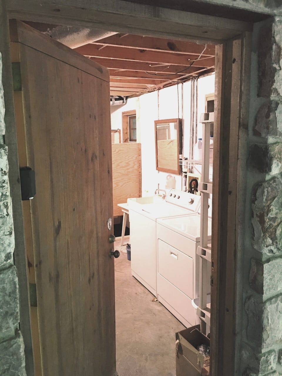 Washer and dryer in the basement along with a spare refrigerator.