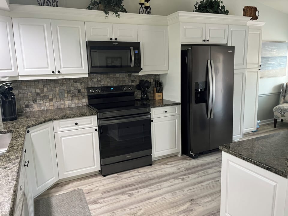 Large kitchen, refrigerator, stove, microwave,  dishwasher, granite countertops