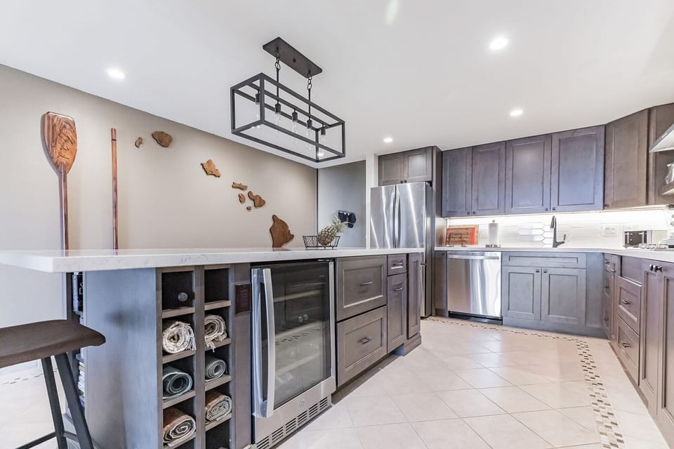 Reno'd kitchen featuring beverage fridge 