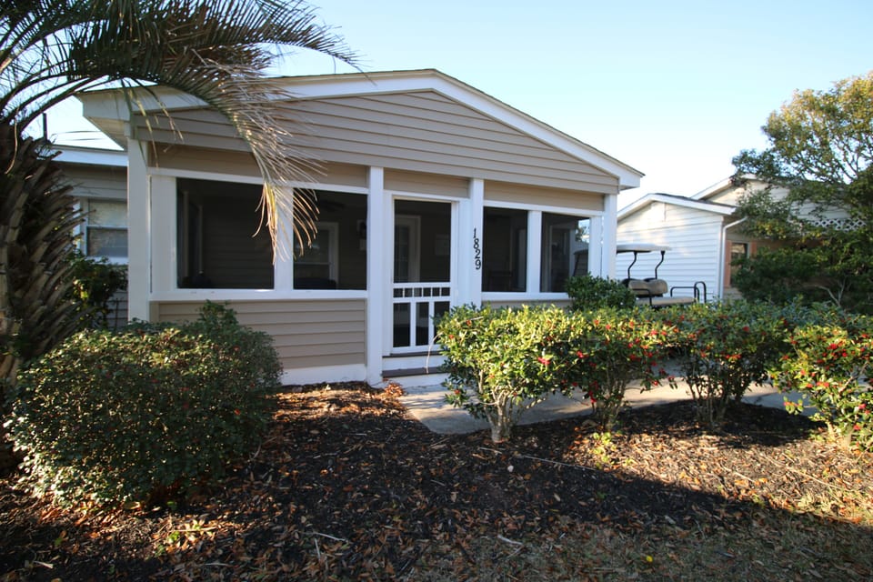 Welcoming front entry with screened in porch