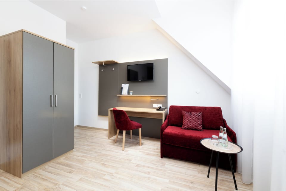 Triple Room, 1 Queen Bed with Sofa bed, Non Smoking | Living area | TV