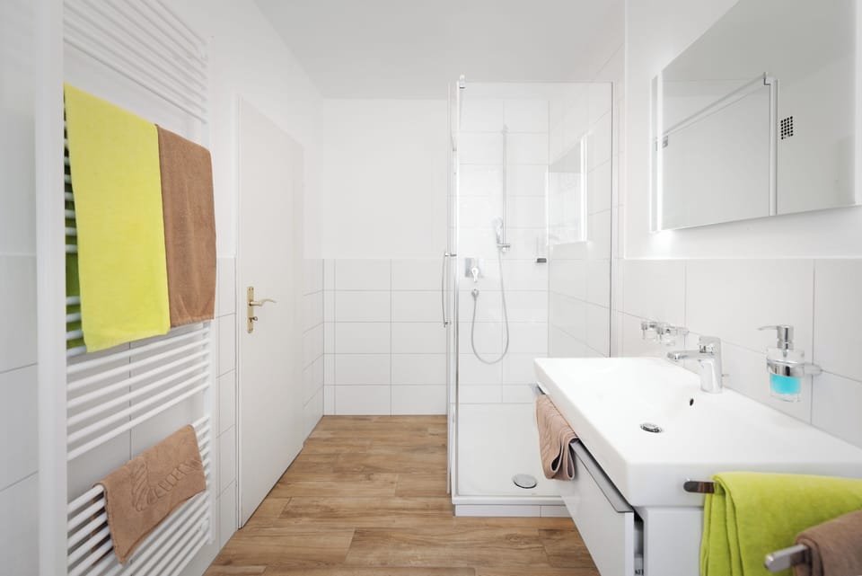 Quadruple Room, 1 Queen Bed with Sofa bed, Non Smoking | Bathroom | Shower, hair dryer, towels, soap