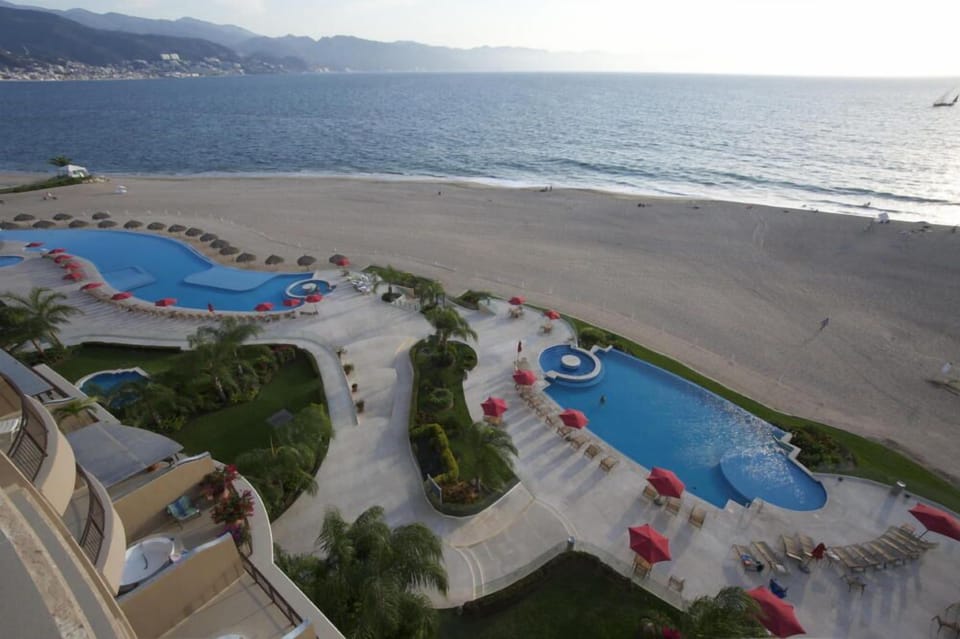 Looking down from balcony at 2 of the 4 infinity pools.