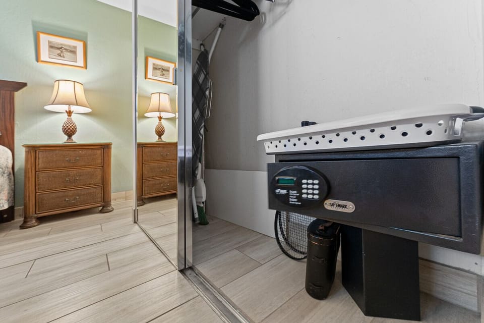 Master closet with digital security safe.