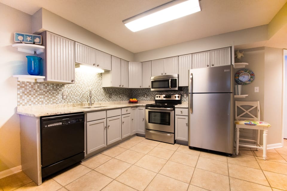 Kitchen has granite countertops and stainless appliances.