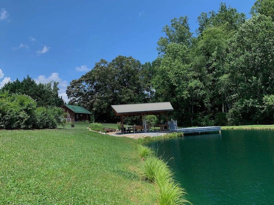 A view from the far side of the lake, highlighting the presence of your cabin.