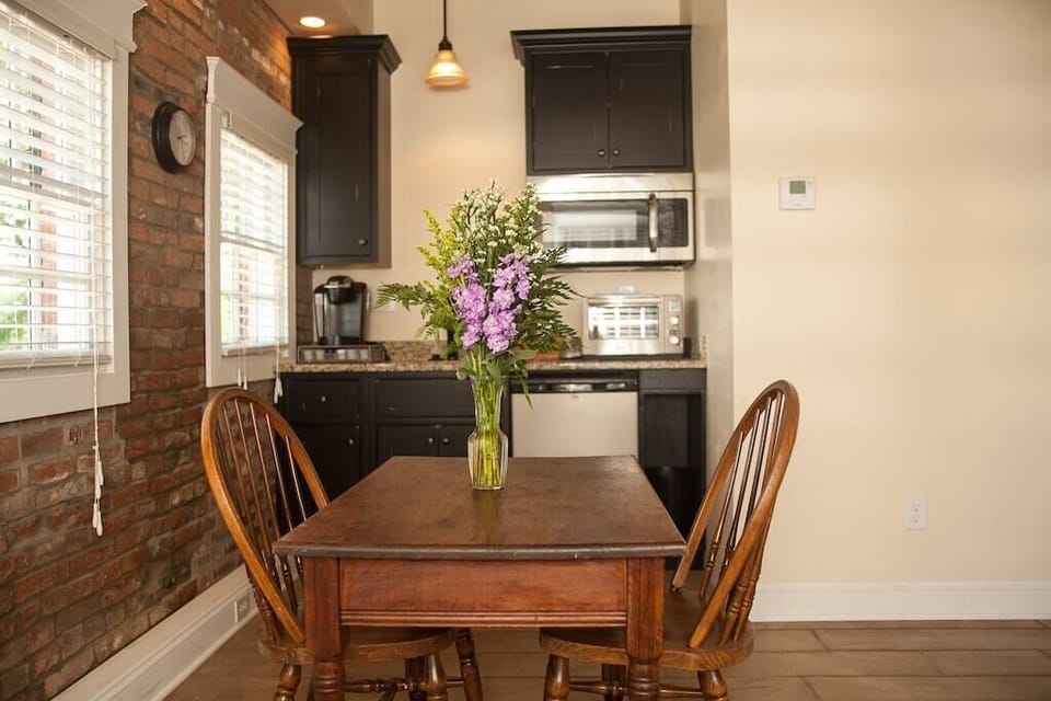 Kitchenette with mini fridge/freezer, microwave, toaster oven, and Keurig coffee