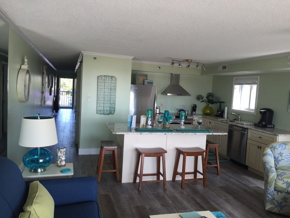 Kitchen and full view screen door for strong "cottage breeze"  through condo