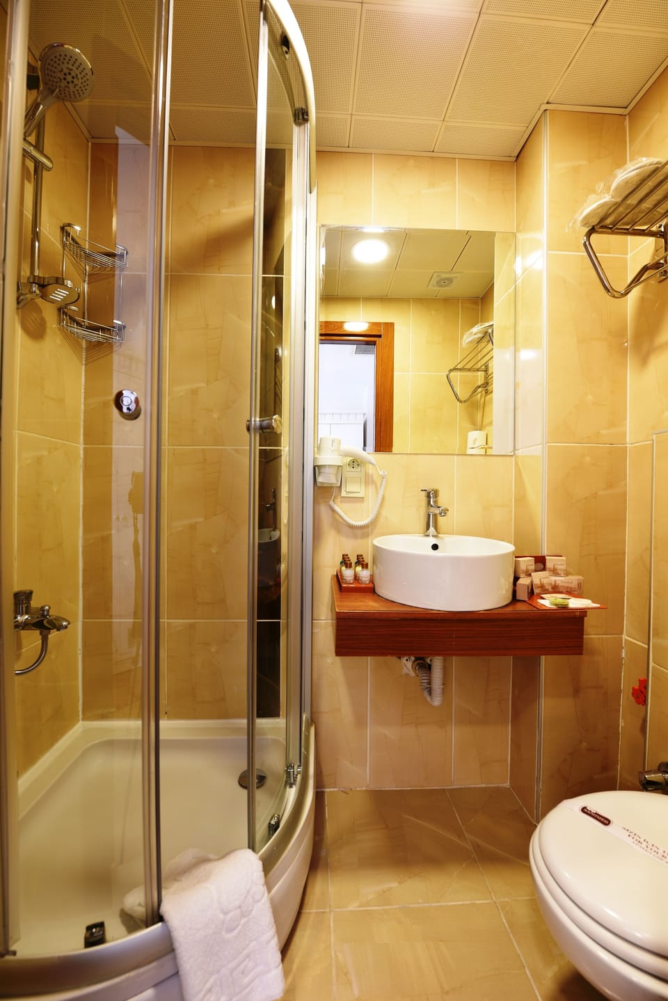 Shower, free toiletries, hair dryer, slippers