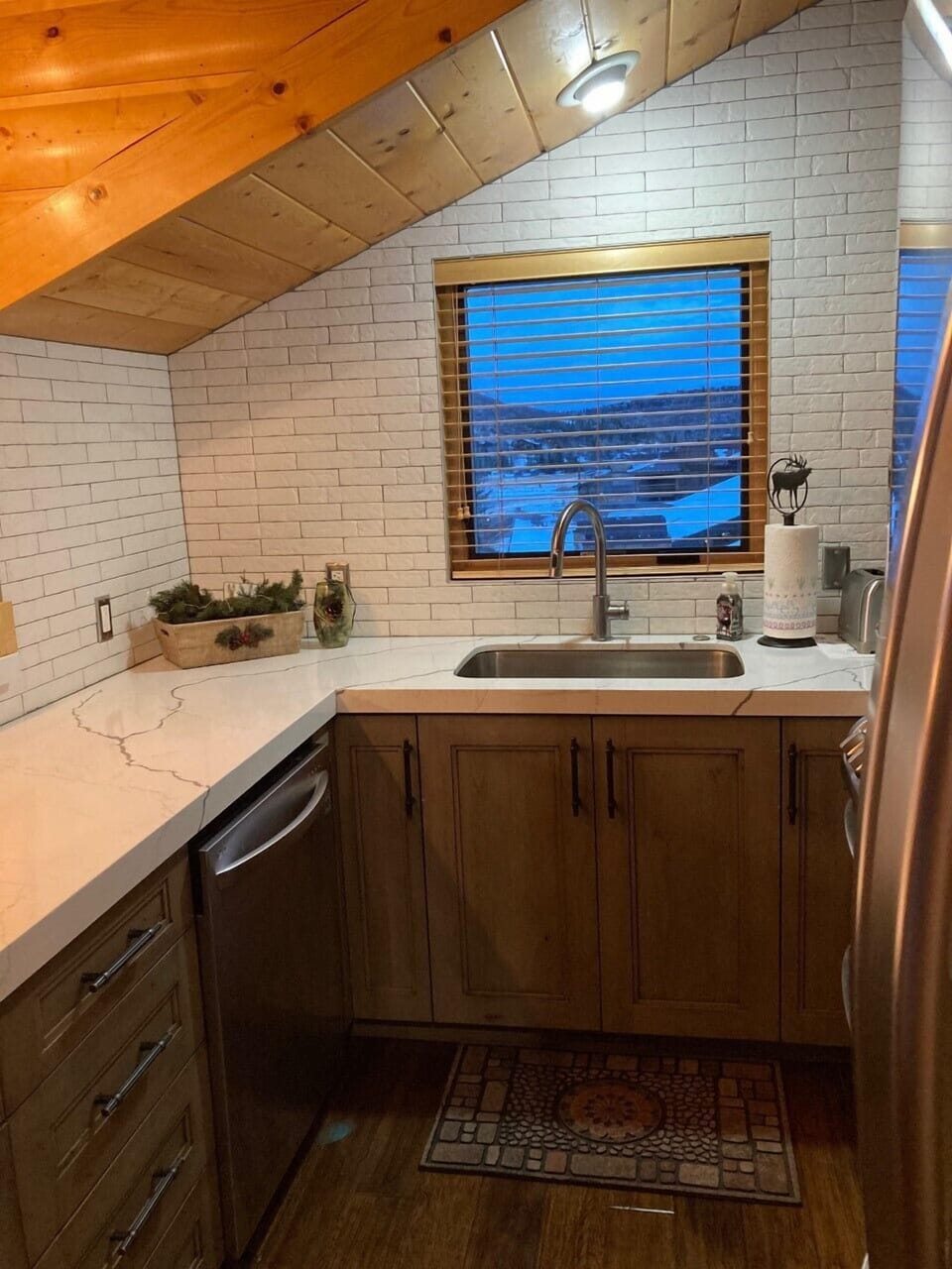 Kitchen: quartz countertops, stainless appliances, window with view
