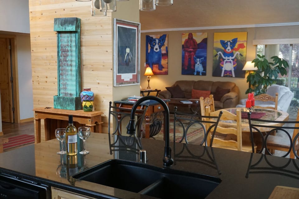 Open kitchen with granite counter tops and updated stainless steel appliances