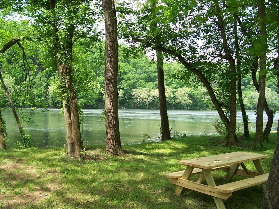 Picnic table down by the river (you cannot see river from house)