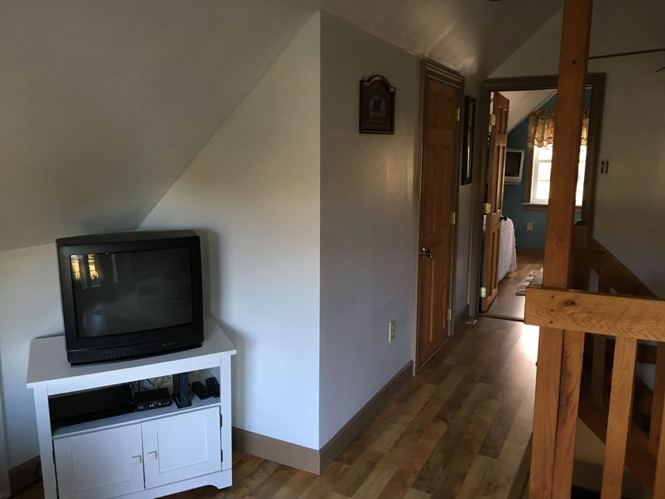 View from the loft into the upstairs bedroom.