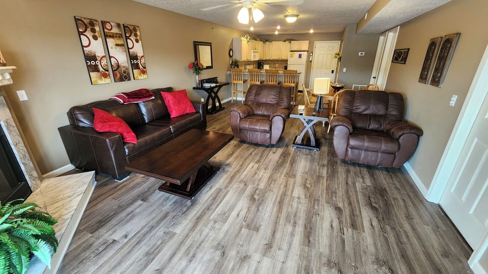 Living Room - New floors, comfortable recliners and sofa that pulls out to a bed