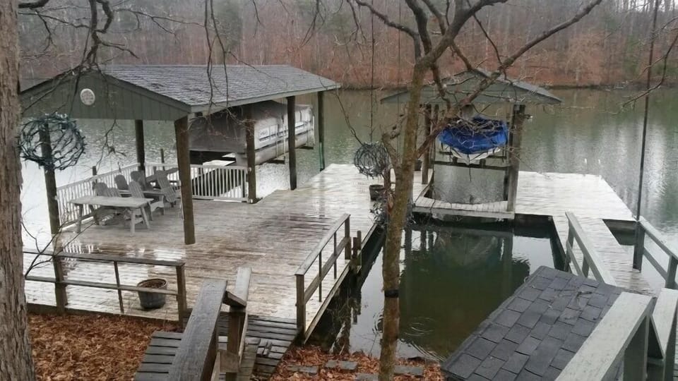 Larger dock with 2 boat lifts, 2 floating docks, and covered lounging area
