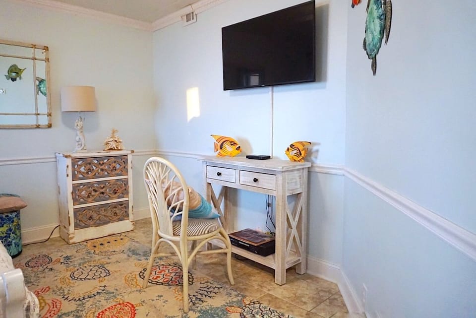 Small workspace and TV in downstairs bedroom