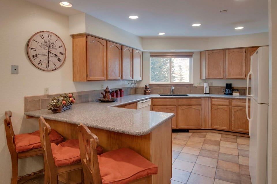 Large kitchen includes everything for cooking and for the dining table.