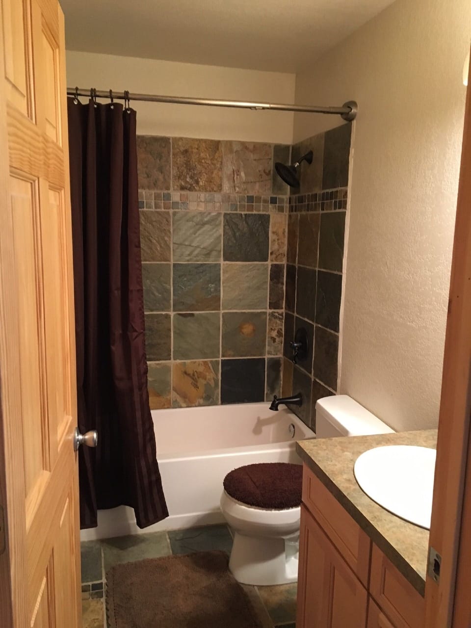 Bathroom conveniently located between two downstairs bedrooms.