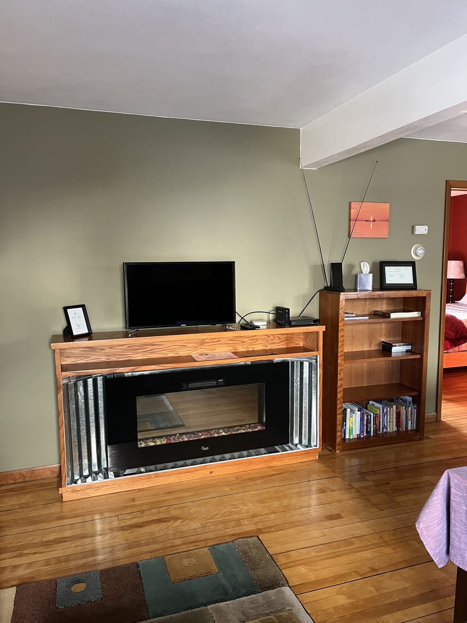 Electric fireplace, TV with DVD player, Wi-fi, assortment of books.