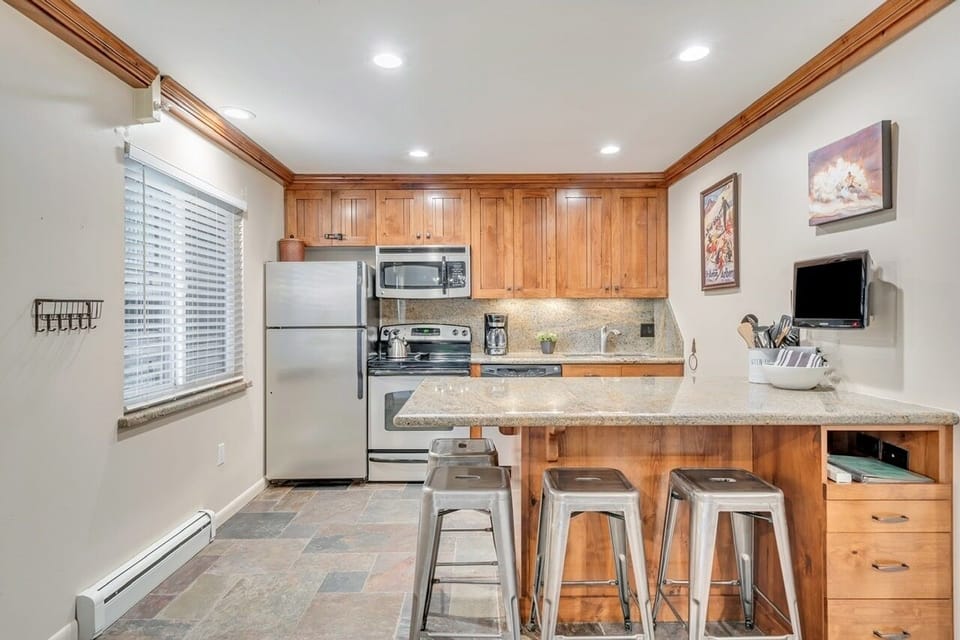 Upgraded kitchen with stainless steel appliances.