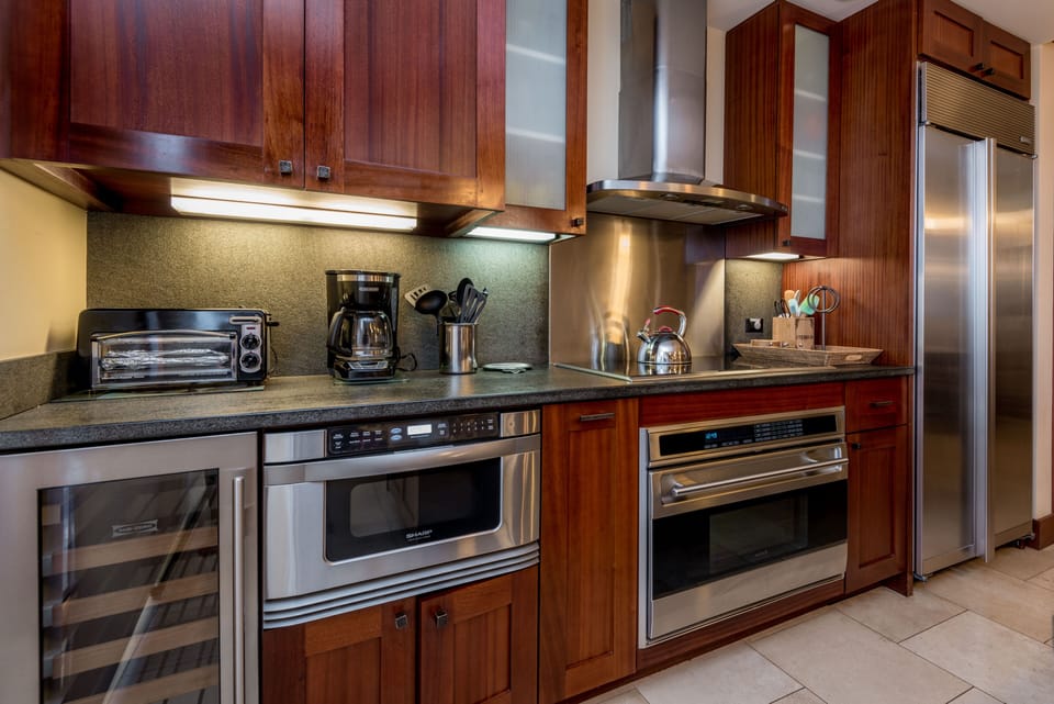 Cook meals with high-end appliances, including a wine cooler.