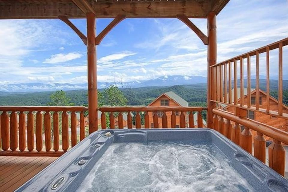 - Soak in the bubbling hot tub with endless views of the Great Smoky Mountains   - Perfect for unwinding under the stars or after a day of exploring nearby trails   - The private deck setting offers peace, comfort, and unbeatable mountain scenery