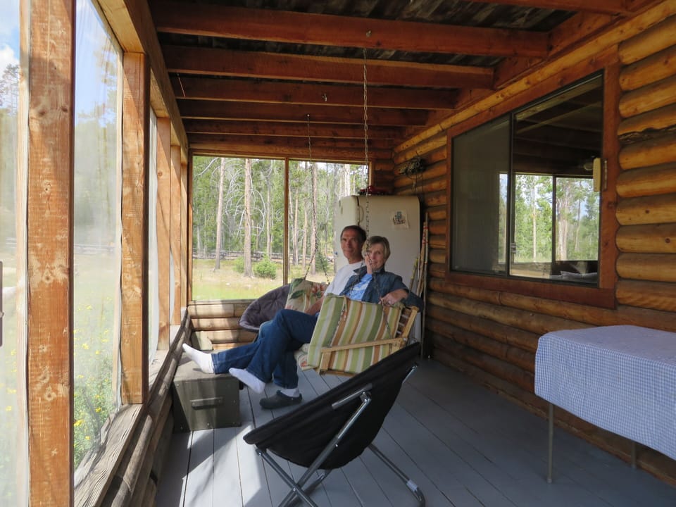 Front screened porch with owners Jim and Adrienne