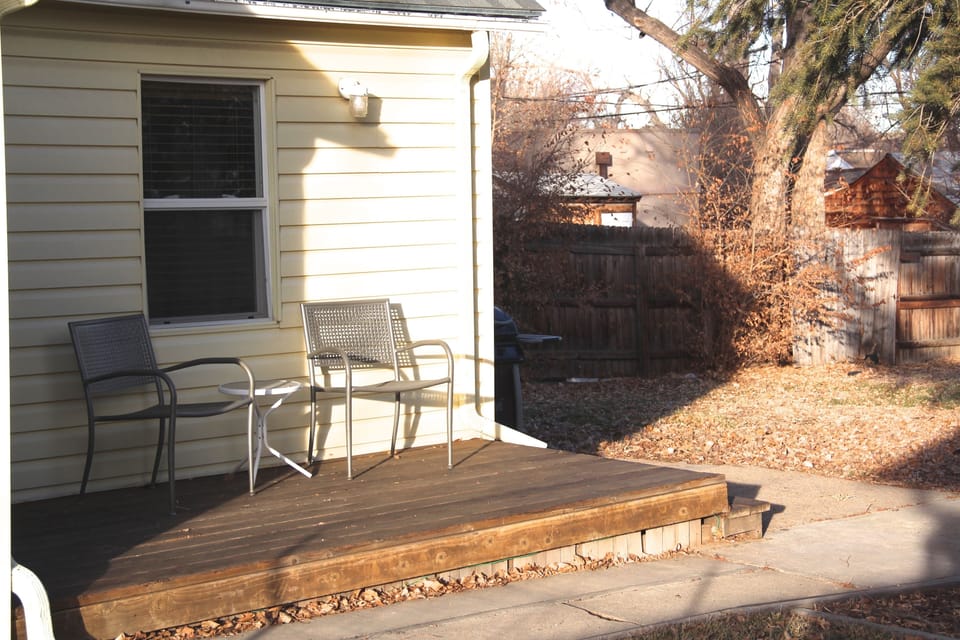 Rear Deck looks over fenced private back yard, Faces East. Morning Coffee!