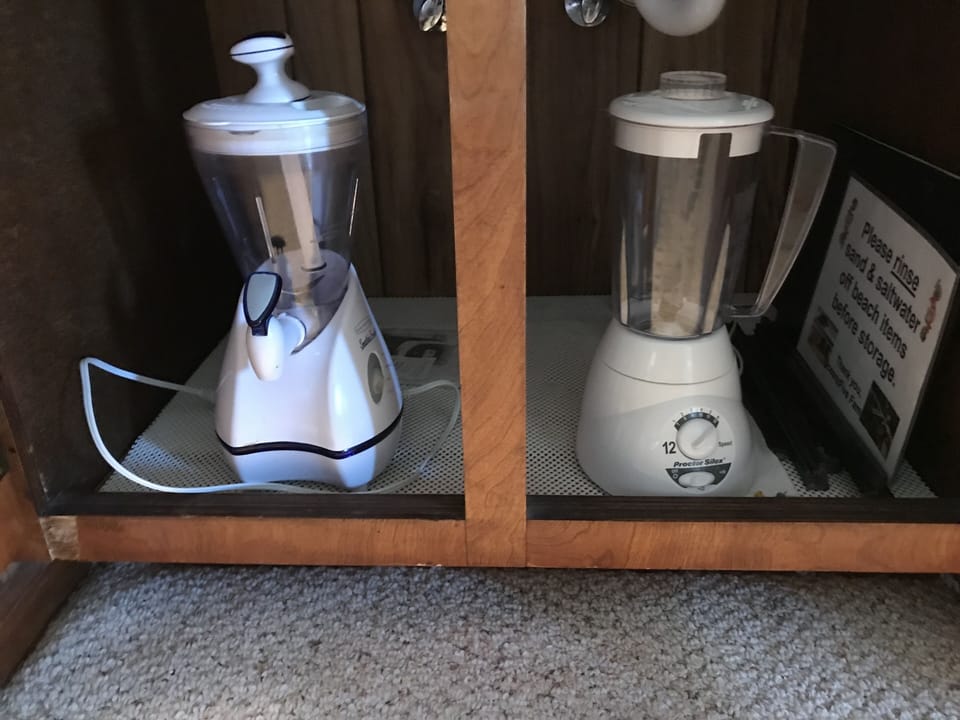 Blender and juicer in wet bar cabinet