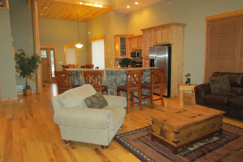 Living Room Kitchen and Dining area, entry door.