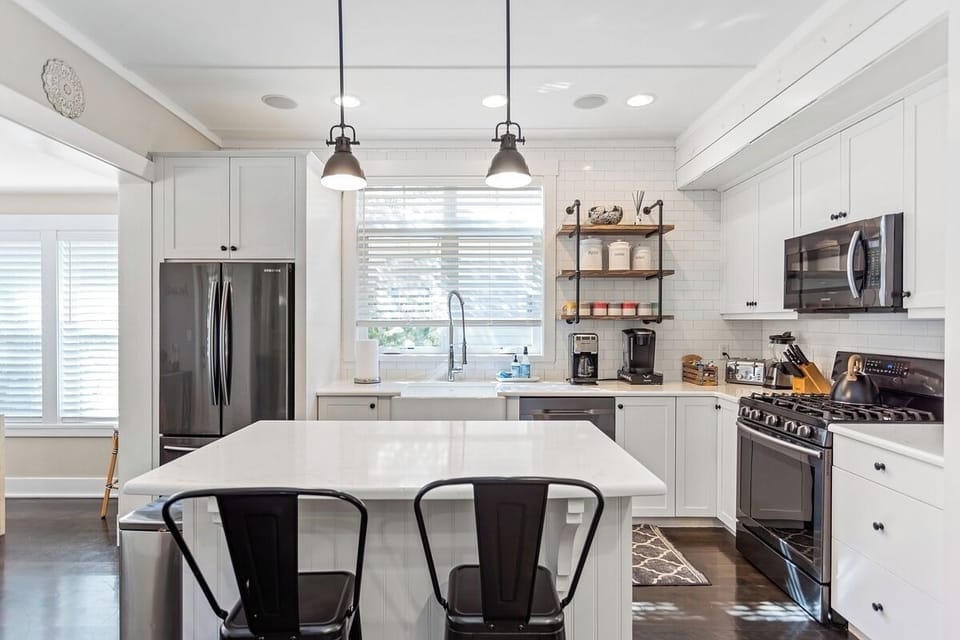 Bright kitchen with new appliances and equipped with everything you need