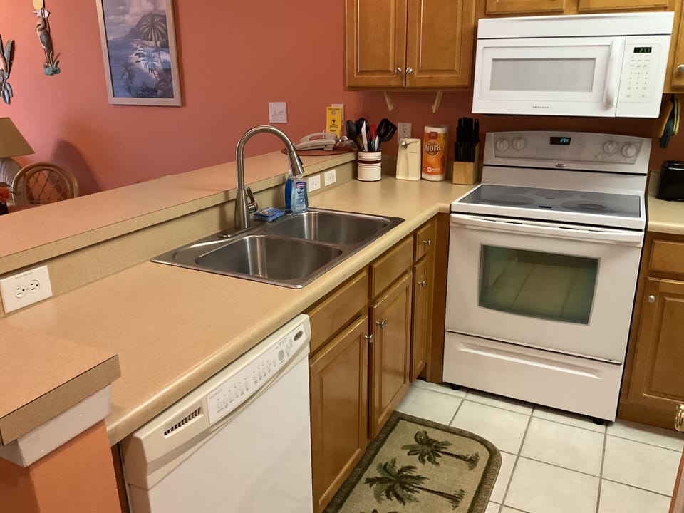 Well stocked kitchen with d/w, microwave,  range, fridge