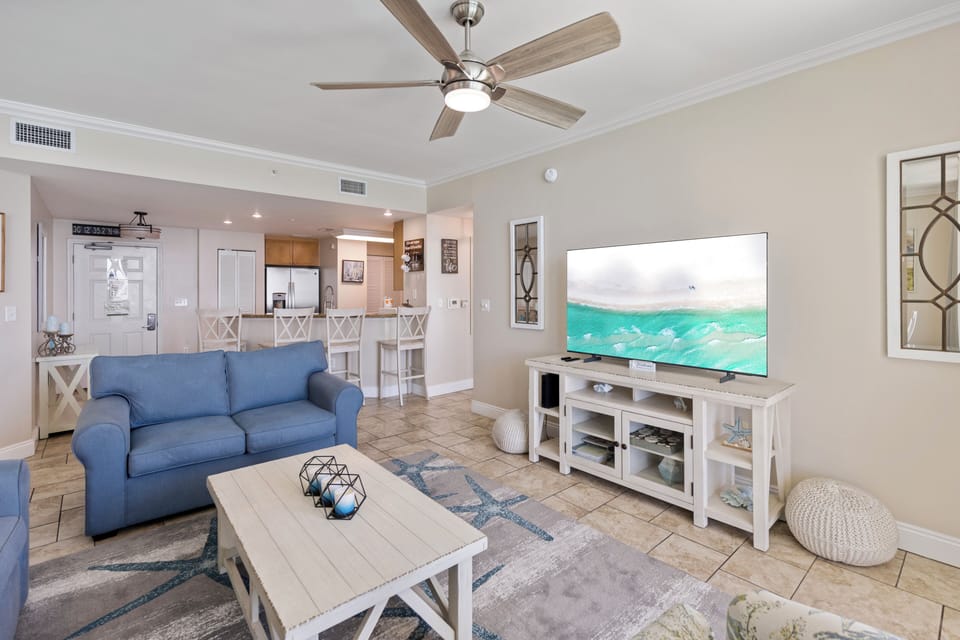 Sink into coastal comfort in your bright living space, where ocean-blue furnishings and nautical touches create your perfect beach retreat.