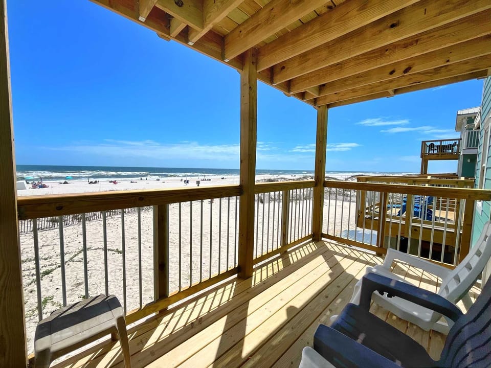 First floor & truly beachfront.