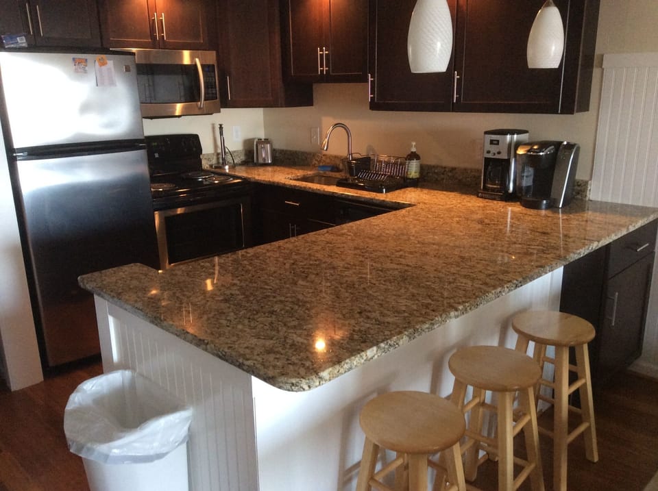 Large counter-top area extends dining surface.