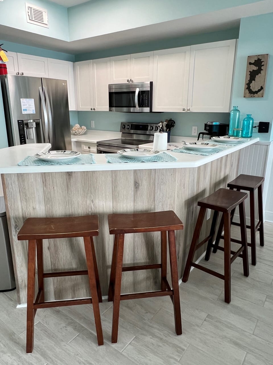 Kitchen with ocean view & fully stocked with all you will need to prepare meals 