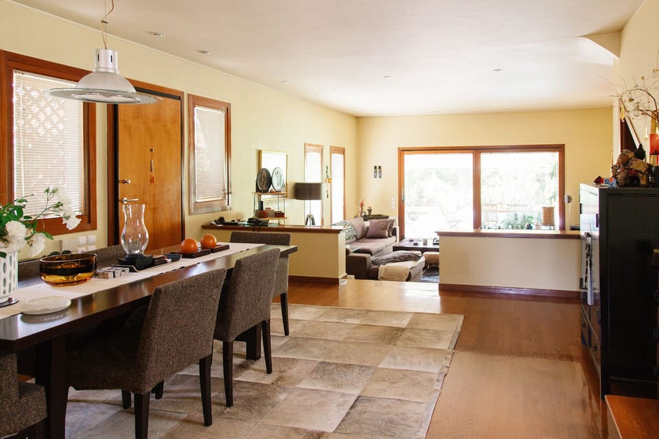 The open plan dining room, overlooking the living area.
