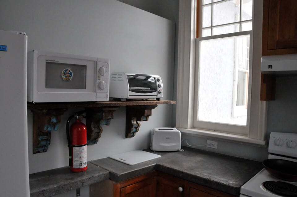 There is a stove plus a microwave and a toaster oven.

